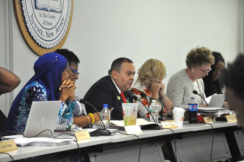 Newark Superintendent Roger León and board members discuss agenda items at the first board meeting of the school year.