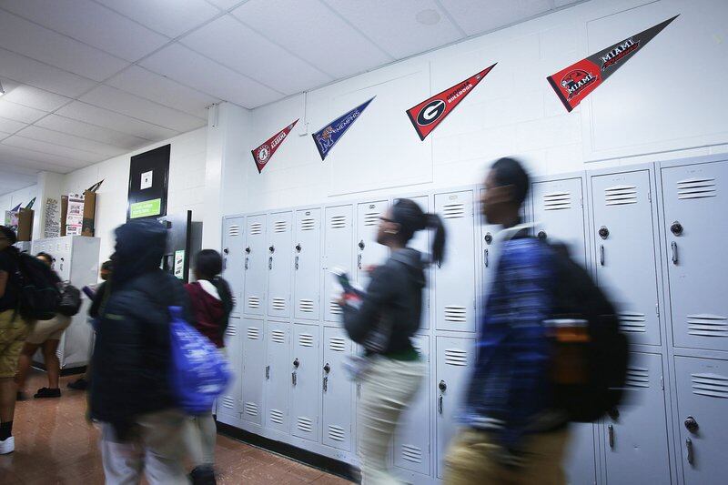 Students walk past lockers at Hillcrest High School, a charter school in Memphis in the Achievement School District, in February 2020. Hillcrest is operated by Green Dot Public Schools.