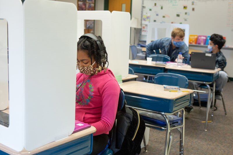The education department says it has a comprehensive strategy to curb the spread of COVID within schools next year. The strategy includes two air purifiers in each classroom along with mandated masking and social distancing.
