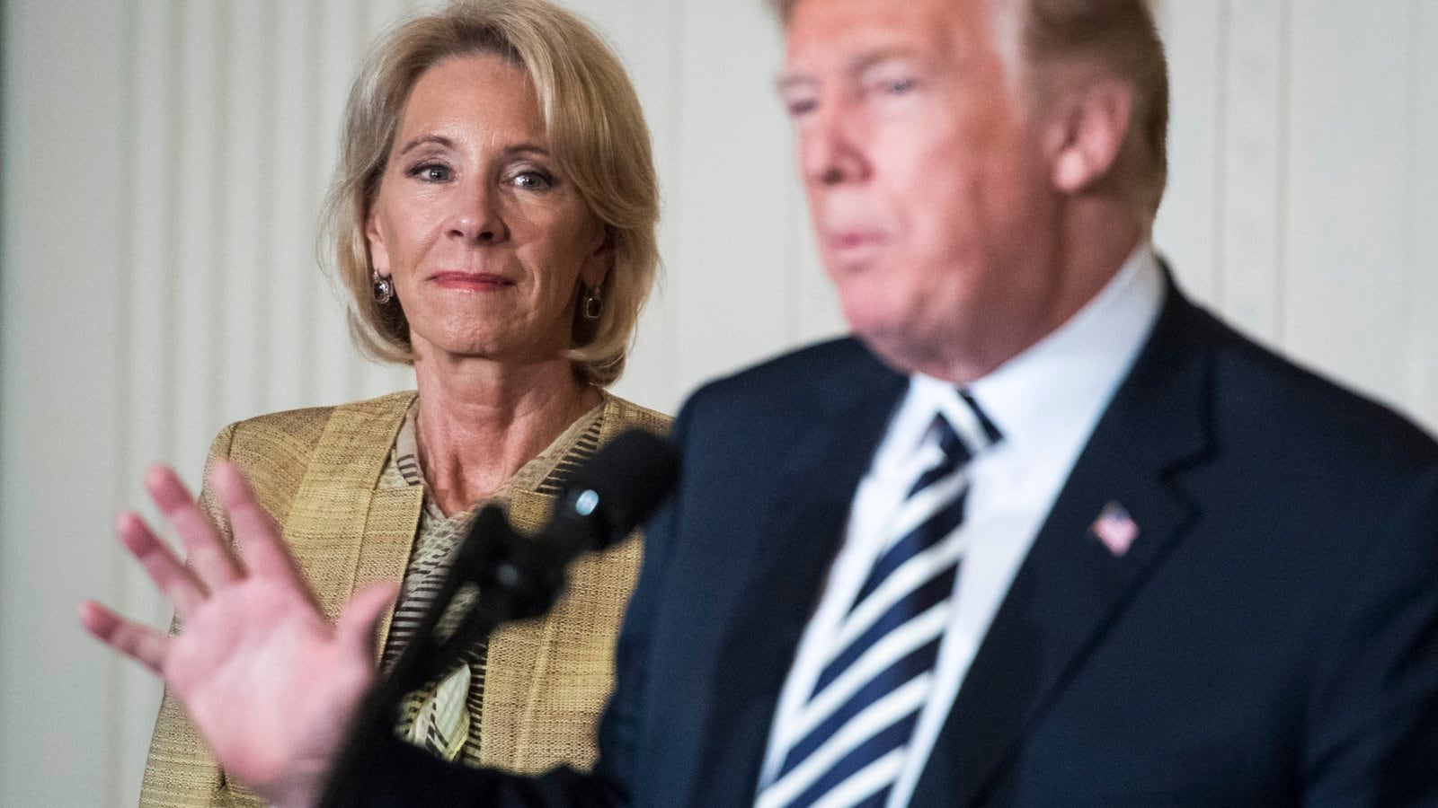 WASHINGTON, DC - MAY 2: Secretary of Education Betsy DeVos listens as President Donald J. Trump gives remarks at the National Teacher of the Year reception at the White House on May 02, 2018 in Washington, DC. (Photo by Jabin Botsford/The Washington Post via Getty Images)