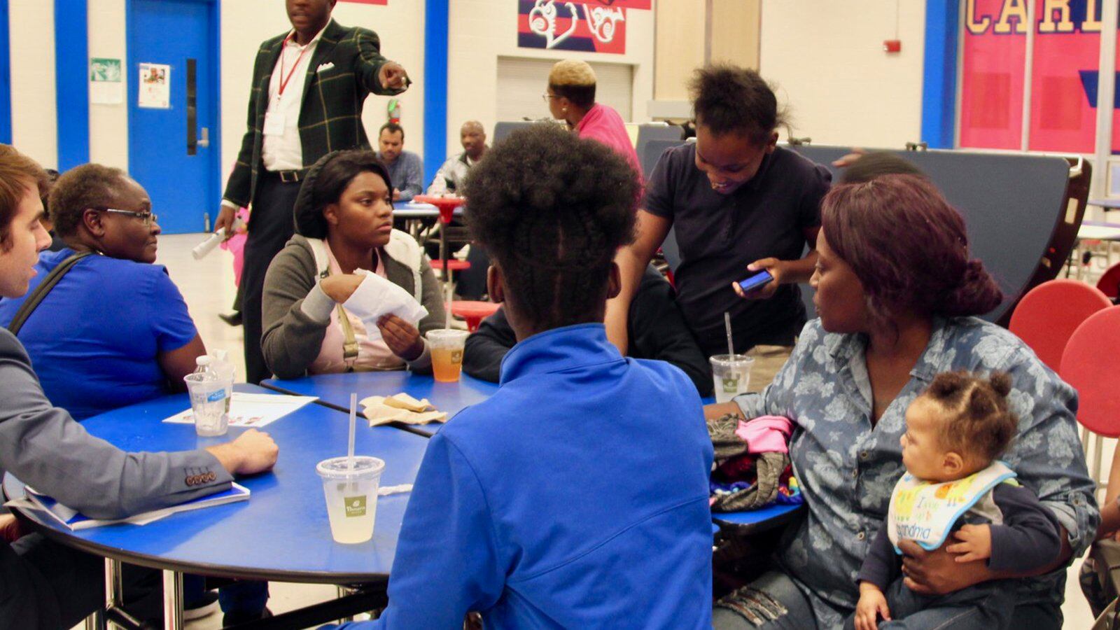 Families weigh in during a conversation on school turnaround at Wooddale High School. It was one of several stops state officials made during a listening tour on the future of improving the state’s lowest-performing schools.