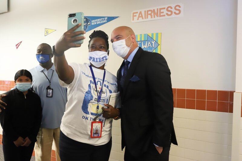 Superintendent Nikolai Vitti poses for a selfie with a teacher at Priest Elementary-Middle School in Detroit.