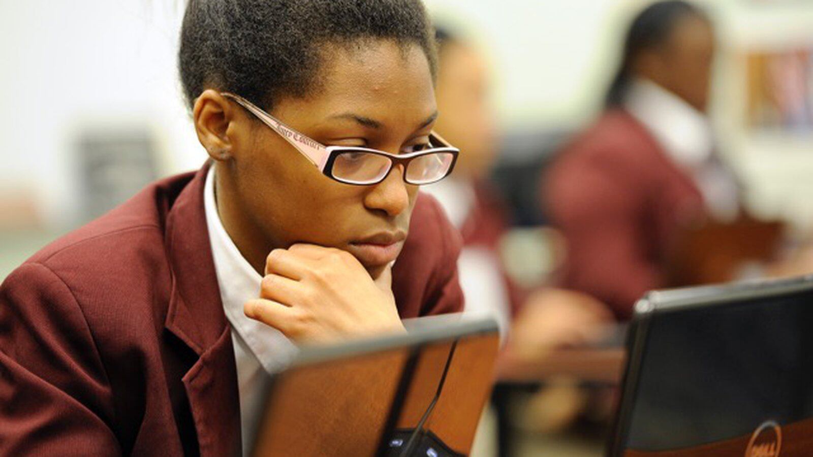 Kayla Davis works on a college admissions form. Stock photos for Chalkbeat stories. Photos made at Tindley Accelerated School, 3960 Meadows Dr, Indianapolis, Indiana.  Nov. 22, 2013. (Photo by Alan Petersime)