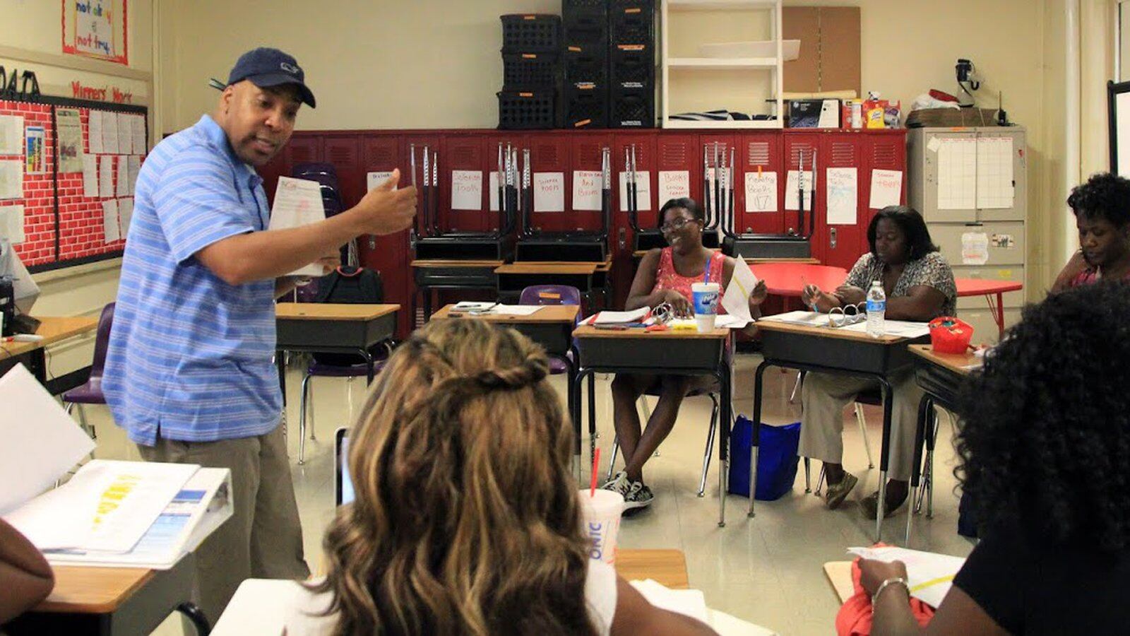 Principal Rodney Rowan works with reading teachers on instructional strategies they will use during the upcoming school year at Cherokee Elementary School, an iZone school in Memphis that posted big gains in its 2015 student test scores.