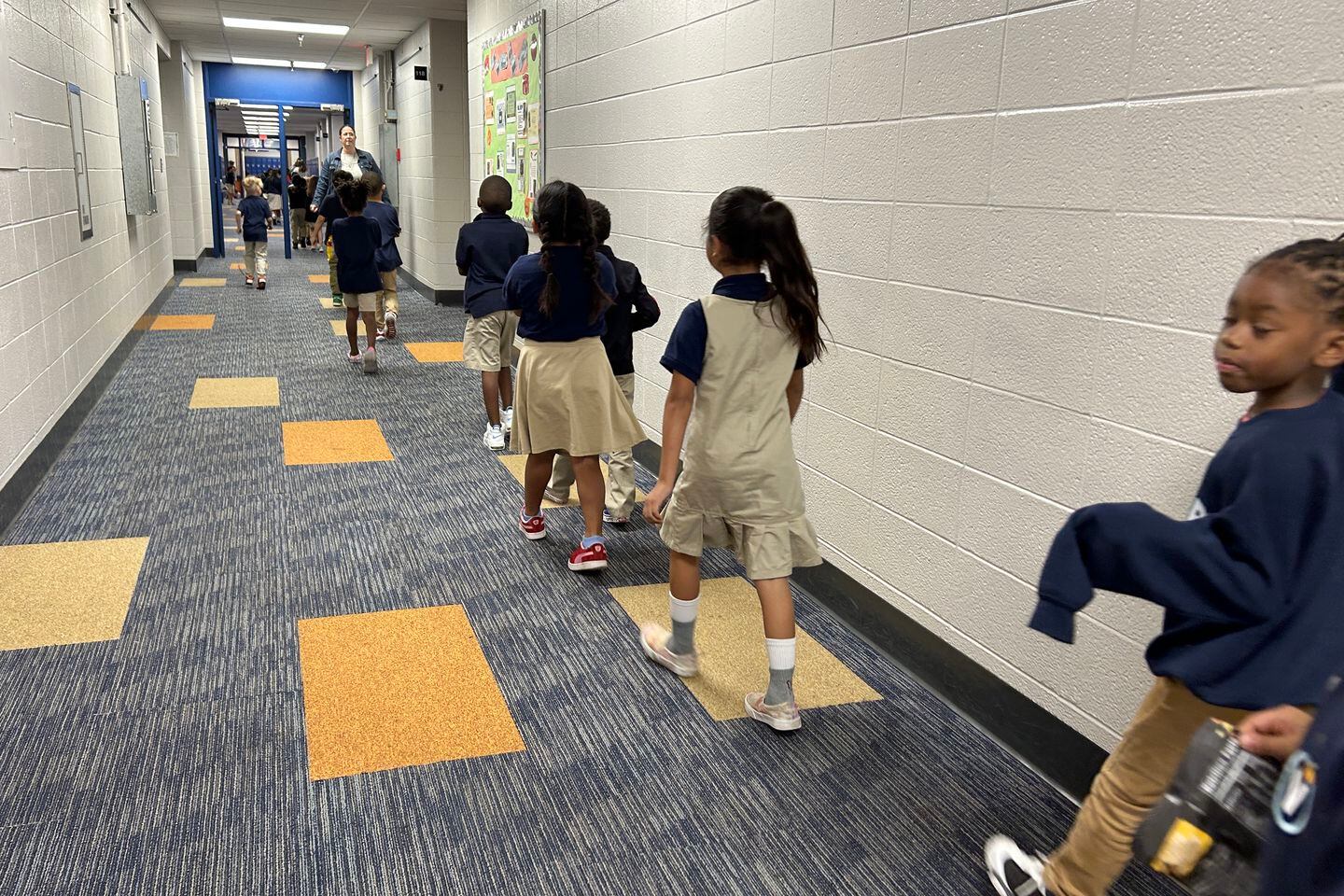 Students walk in the hallway at Victory College Prep on Sept. 29, 2023. The charter school has exceeded pre-pandemic proficiency levels on both the ILEARN and IREAD state tests since it cut ties with its management organization and renamed itself in 2019. 