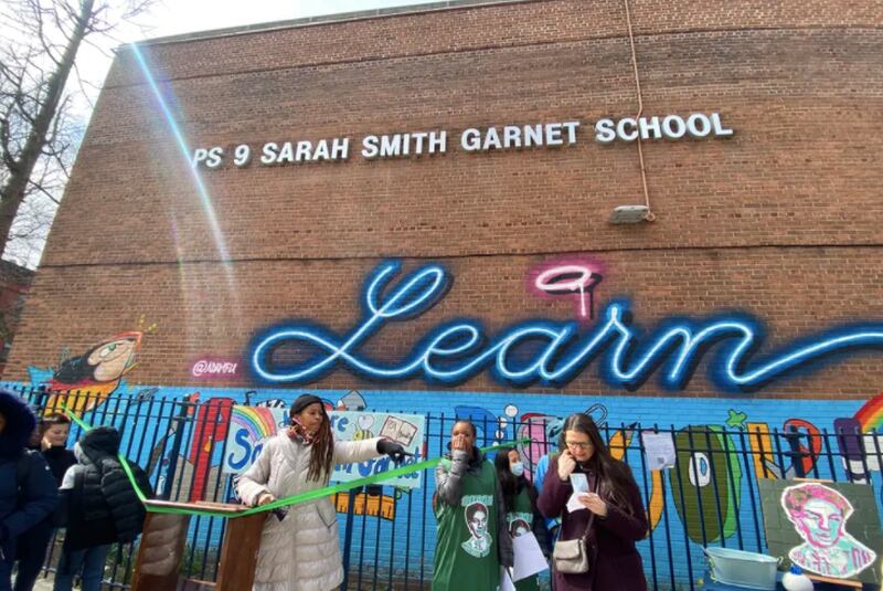 The P.S. 9 community in Prospect Heights cuts the ribbon on a new school sign with Sarah Smith Garnet’s name.