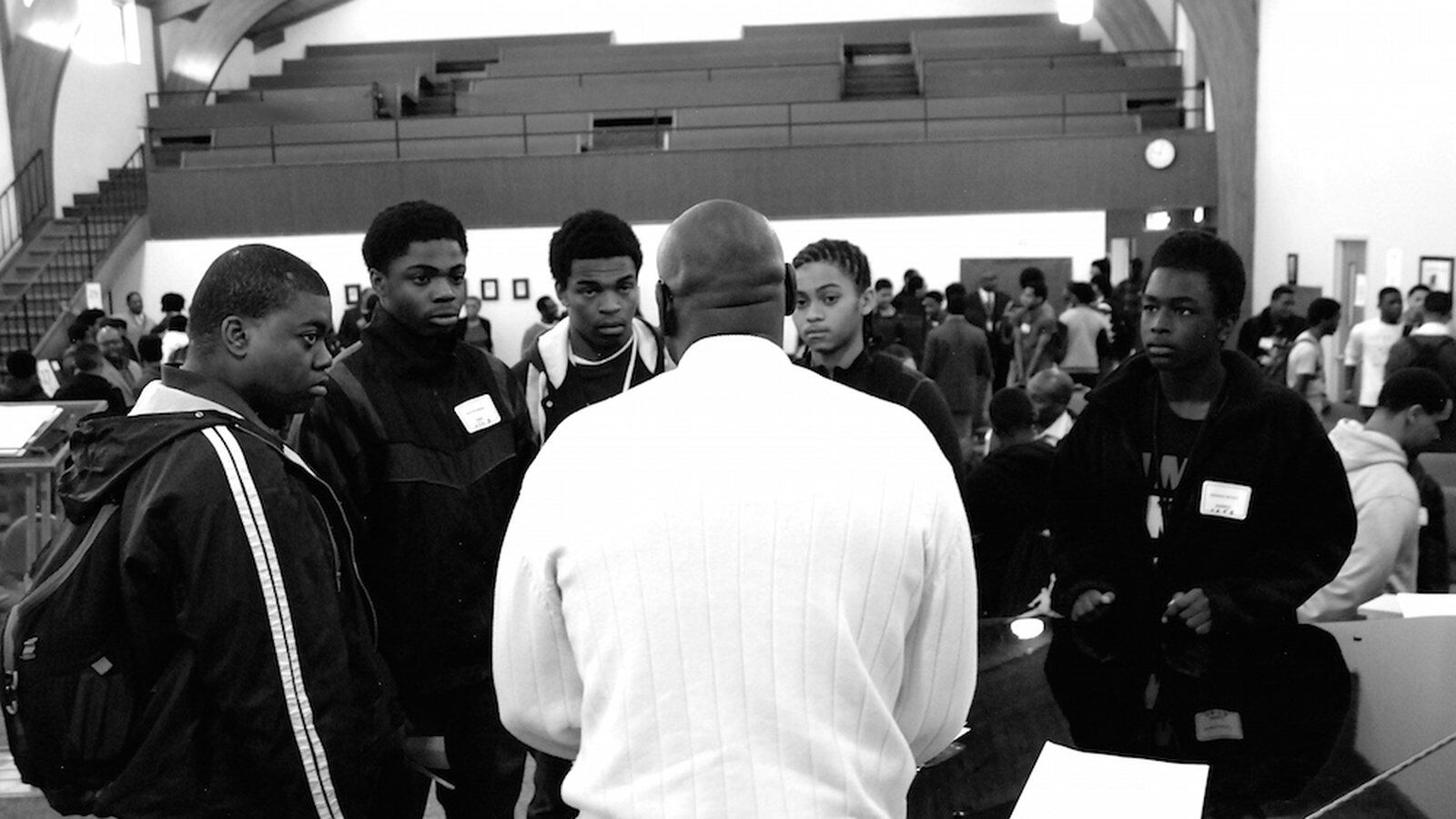 African-American male students from Hinkley High School met with business professionals and discussed race issues Friday at what is expected to be an annual summit for black males.