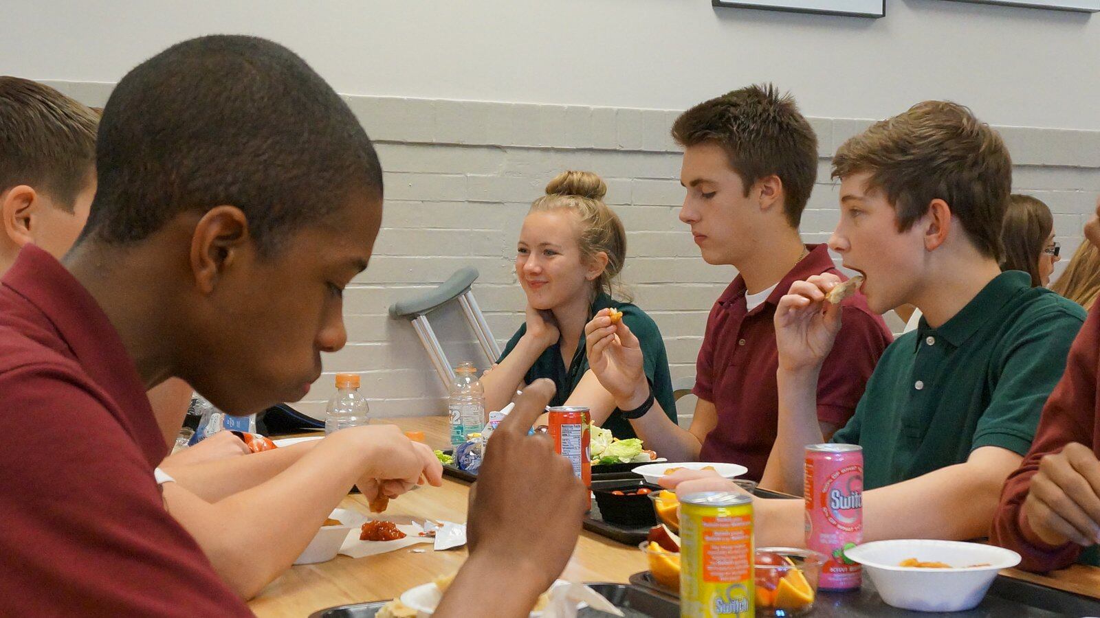 Students eat lunch at the Oaks Academy Middle School, a private Christian school in Indiana that is integrated by design and accepts taxpayer funded vouchers.