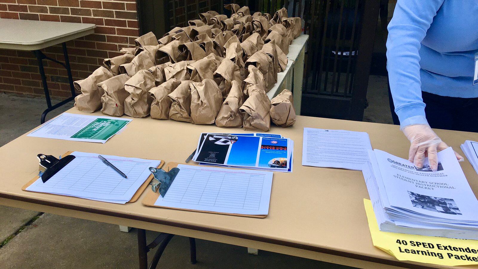 The YMCA took over food distribution for students as district staff prepared paper learning packets for pickup.