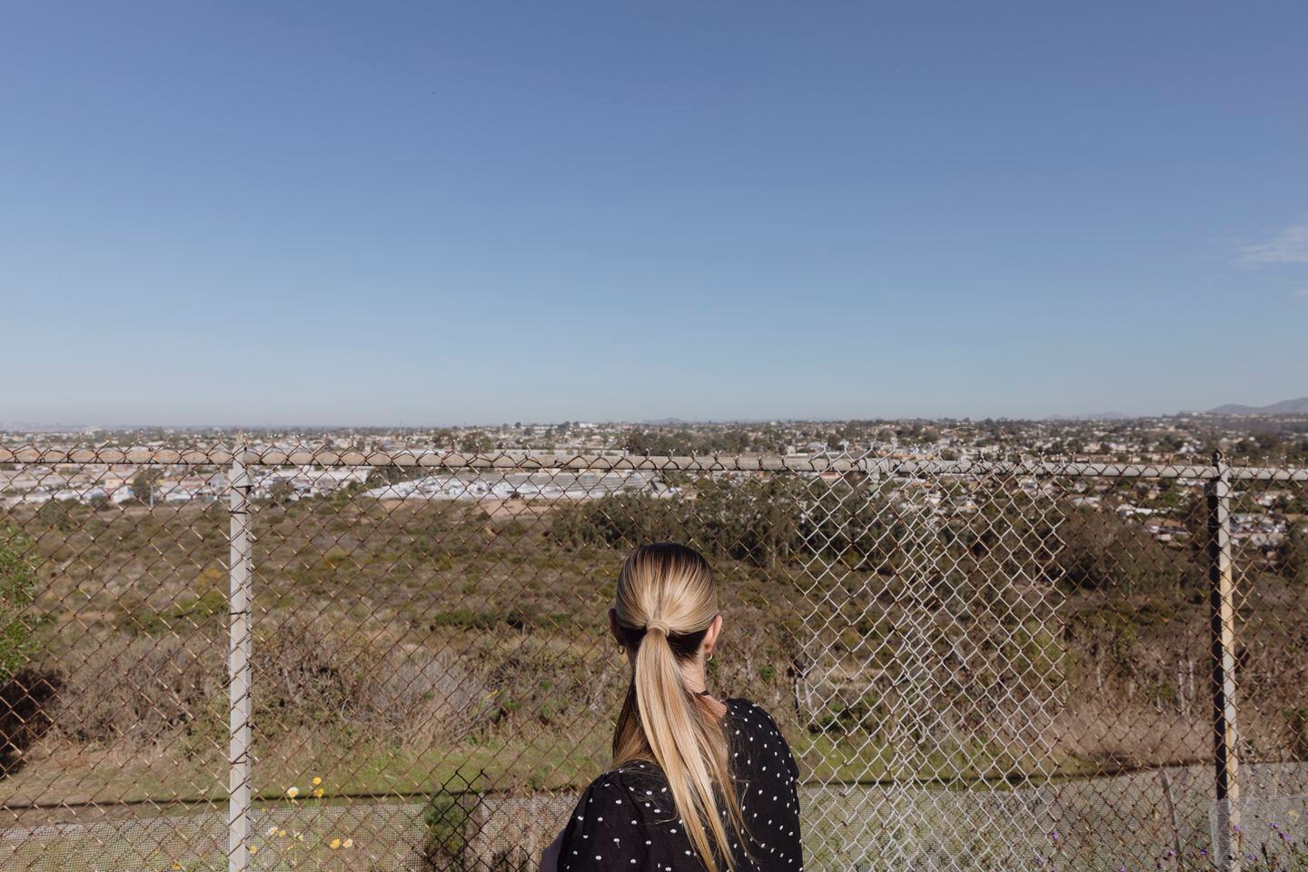 Julia Sutton, a social worker for the Chula Vista Elementary School District in California, looks over homes and an industrial area near Finney Elementary in late November.
