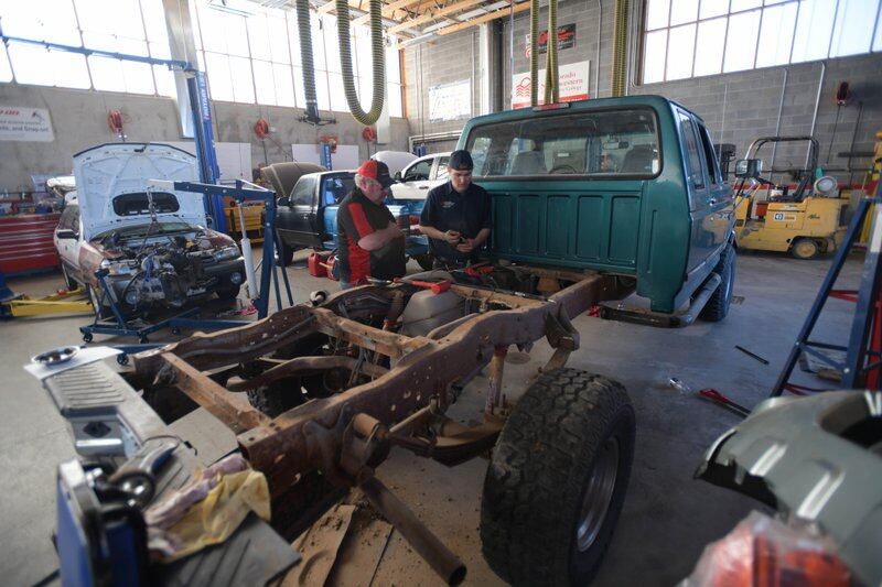 Colorado Northwestern Community College Automotive Technology Lead Instructor Dale Updike works with student Ryan Trussell.