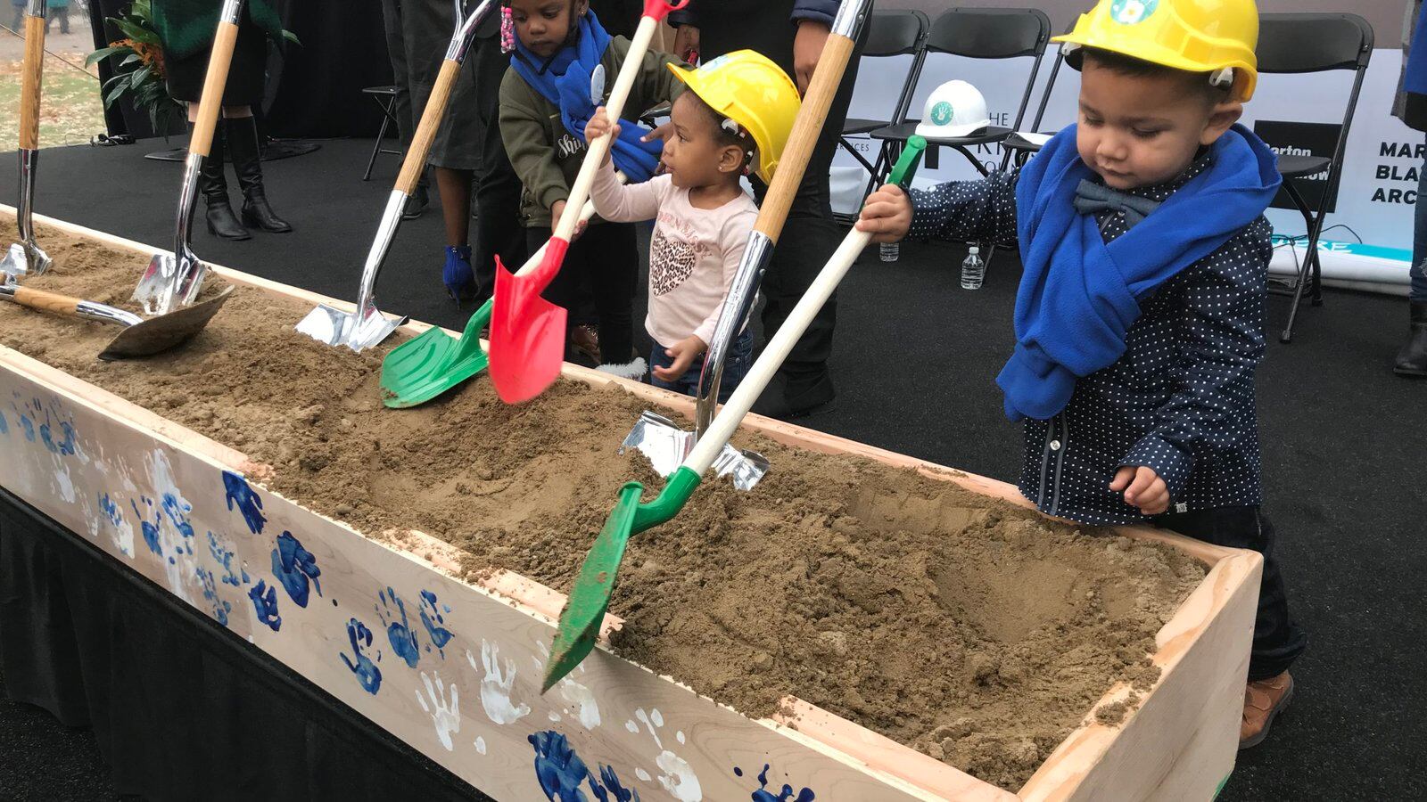 Preschool children do their part during a ceremonial groundbreaking event for a new early childhood education center at Marygrove College.