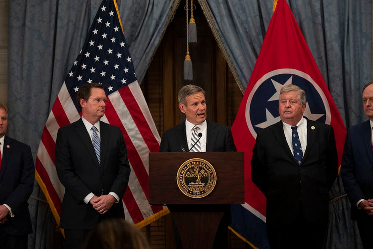 Gov. Bill Lee, flanked by GOP legislative leaders, speaks during a press conference at the close of the 2021 session of the Tennessee General Assembly.