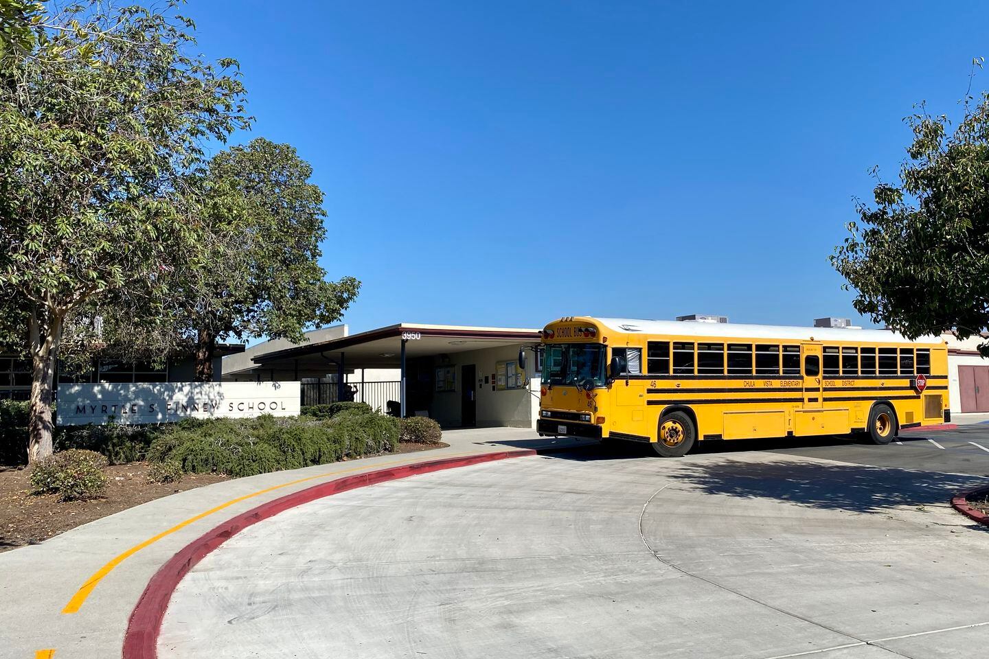 A school bus outside Finney Elementary on Friday, Nov. 3. The school is part of the Chula Vista Elementary School District, which has housed dozens of families in hotels this year.