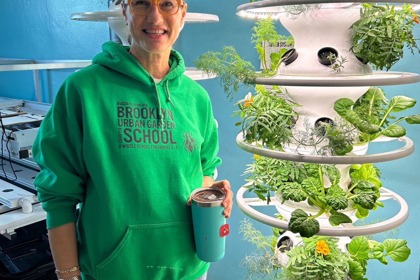 BUGS CEO Susan Tenner stands in the hydroponic garden. Kelly Field for The Hechinger Report