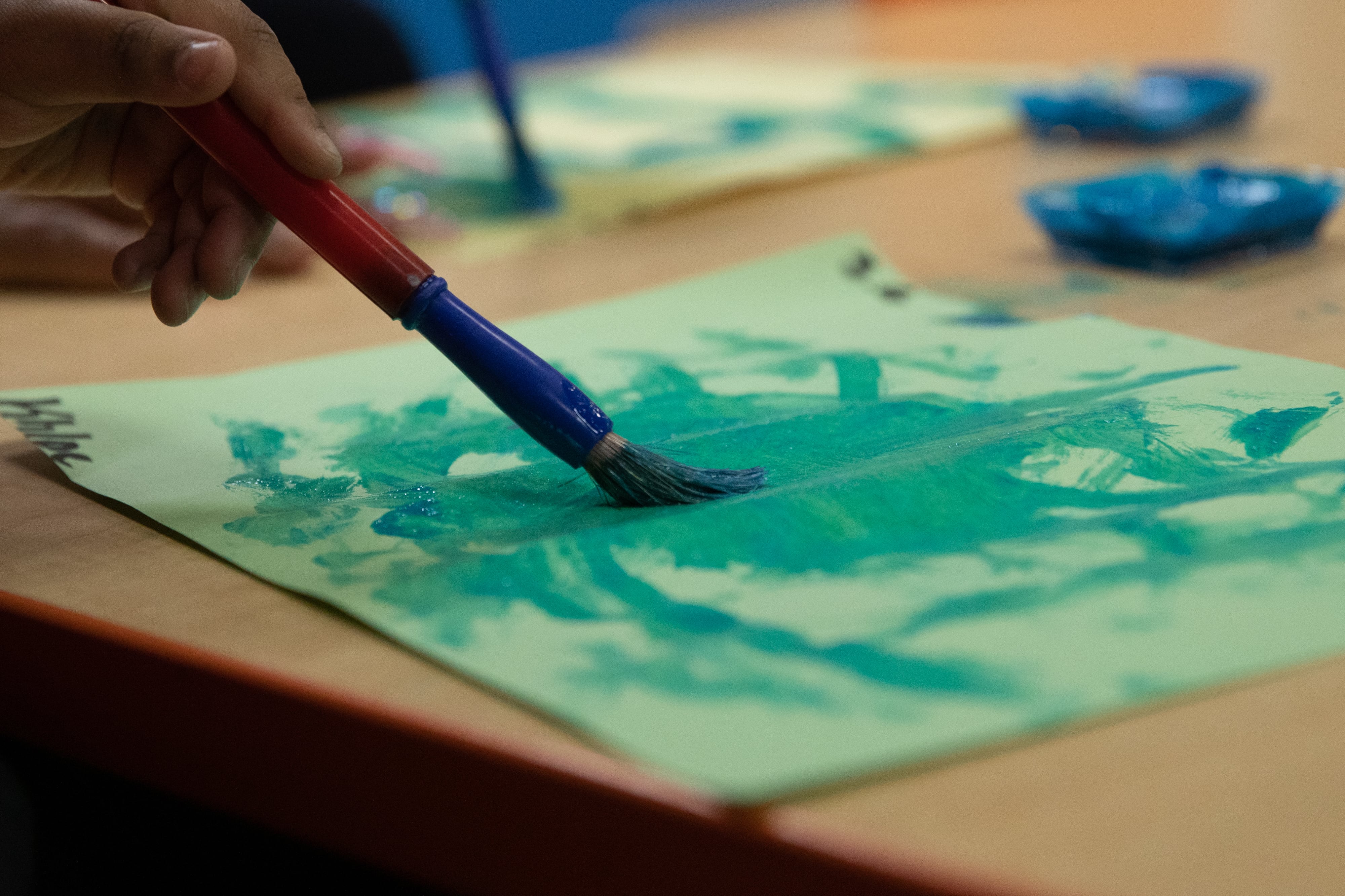 Preschoolers participate in a painting activity at Little Scholars child care center in Detroit, Michigan, U.S., on Thursday April 1, 2021.