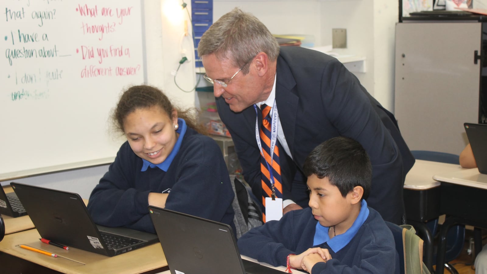 Gov. Bill Lee talks with students at Cameron LEAD, a Nashville charter school that he visited on April 1. Tennessee has struggled to transition to digital testing under its new TNReady assessment.