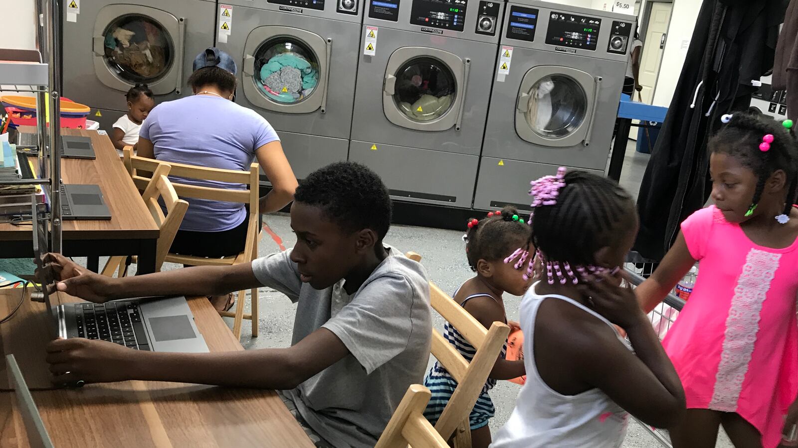 Children at Detroit's Fit and Fold laundromat now have computers to use and books to read while their parents do the wash — part of an effort to bring literacy programs to places where families are.