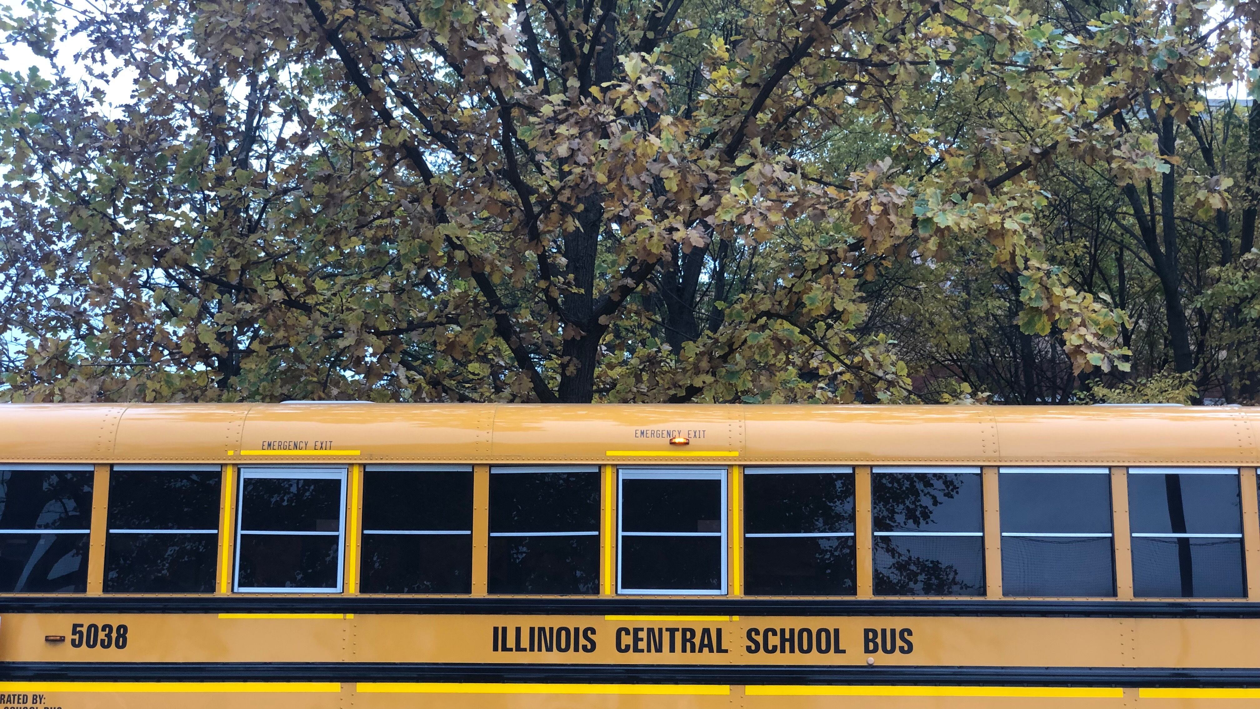 A yellow school bus sits outside a school on Chicago’s South Side.