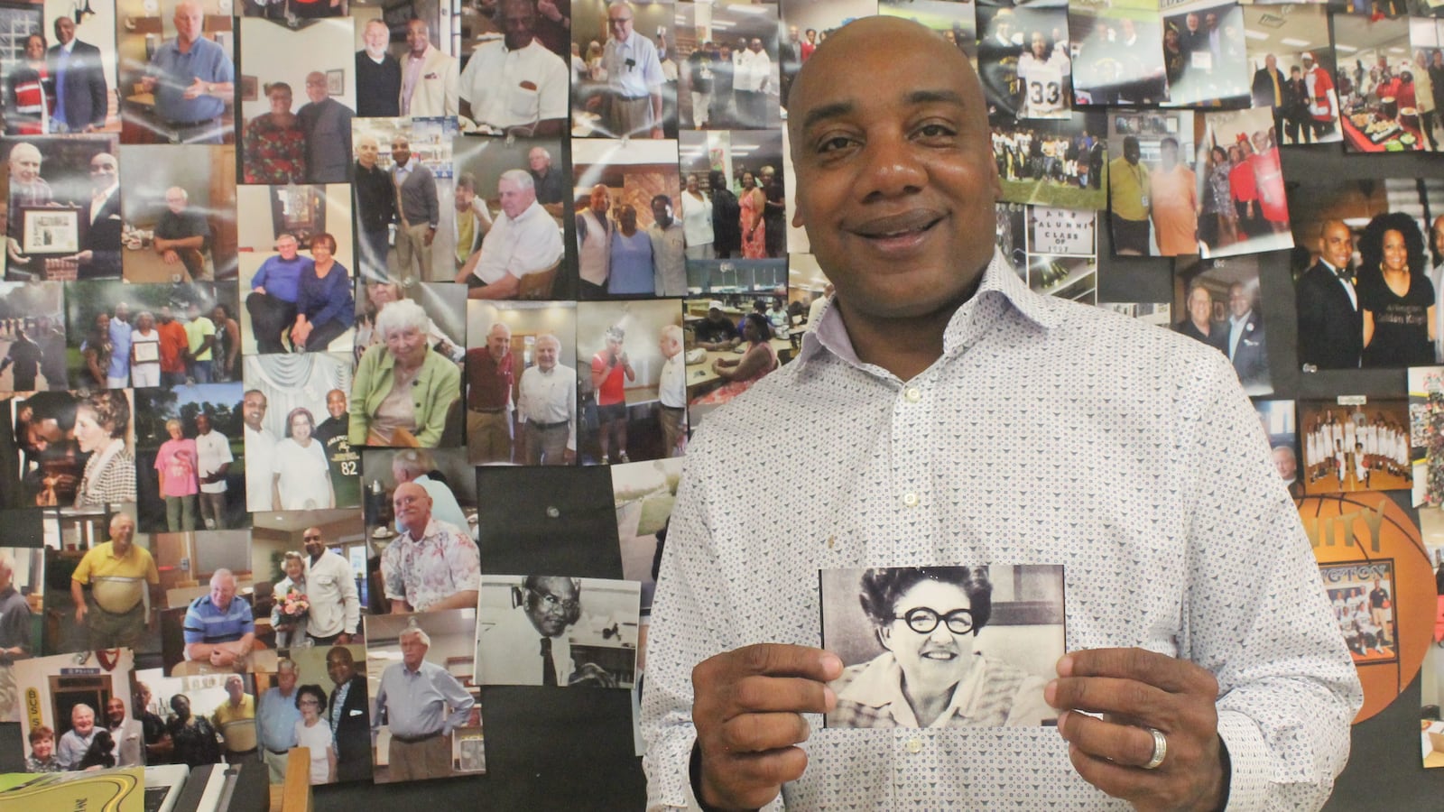 Arlington alumni association president Tim Bass with a photo of his former speech and drama teacher, Daveda Wyatt.