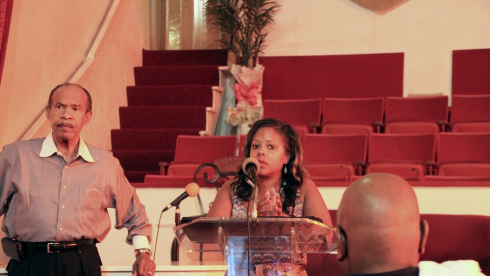 School board member Shante Avant answers questions about shuttered Carver High School from community members in Memphis with Ralph White.