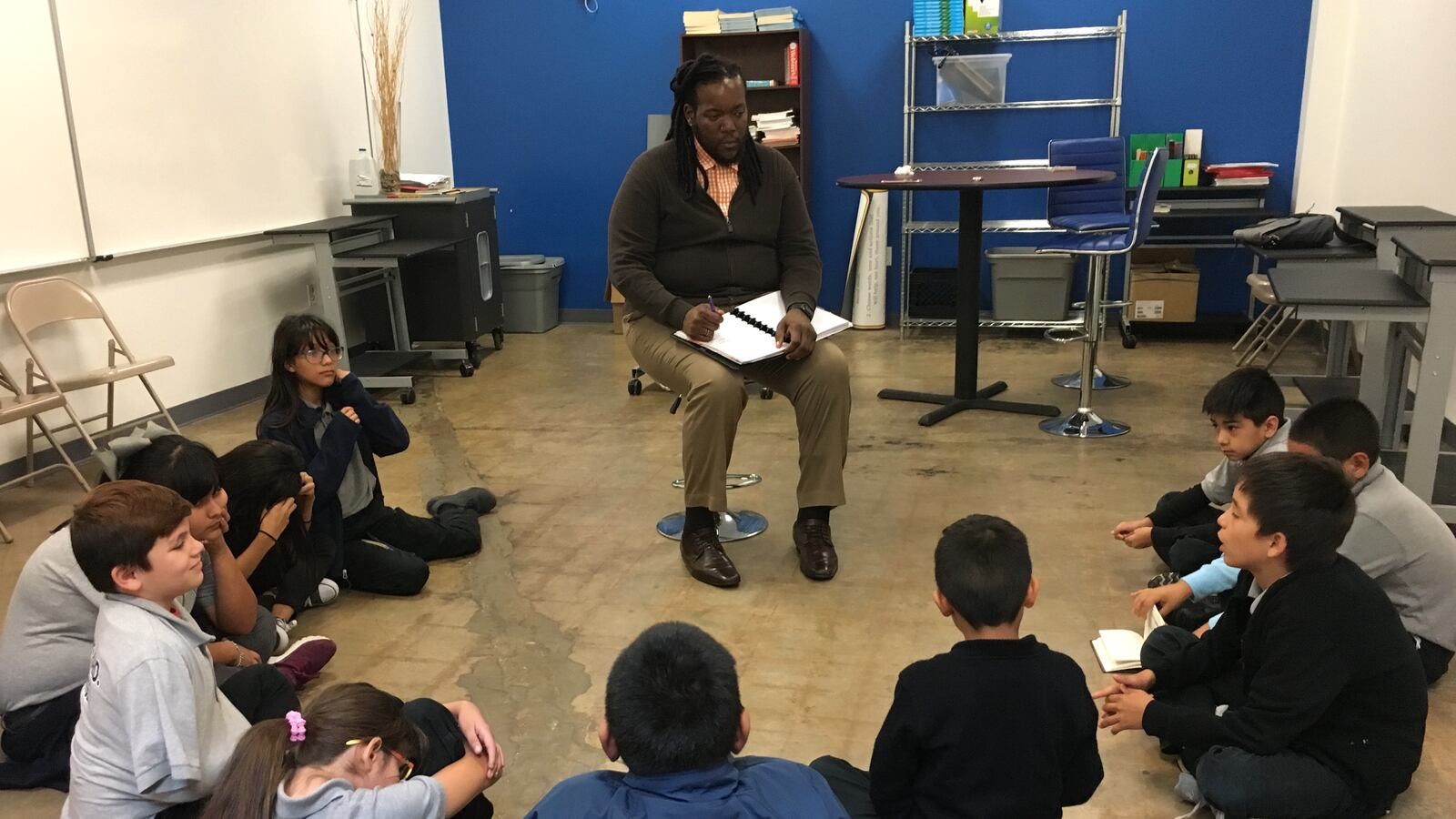 KIPP Camino's Dean of Culture Curtis Bailey conducts a circle with ten fifth-grade students on a recent afternoon at a San Antonio campus.