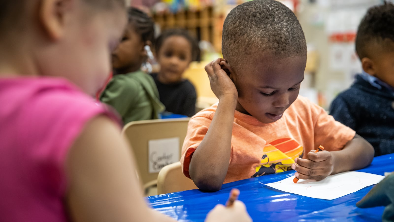 Morghan Hampton, 4, a pre-kindergarten student at Avondale Meadows YMCA Early Learning Center in Indianapolis, draws a picture of his favorite dinosaur during a lesson on Tuesday, April 30, 2019.