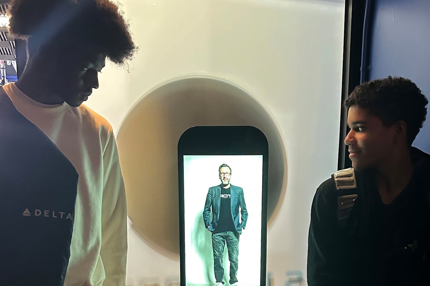David Nussbaum, the Los Angeles-based inventor of a holographic device unveiled at Ralph R. McKee Career and Technical Education High School in Staten Island, gives students a demonstration of the technology. (Trenton Daniel / Healthbeat)