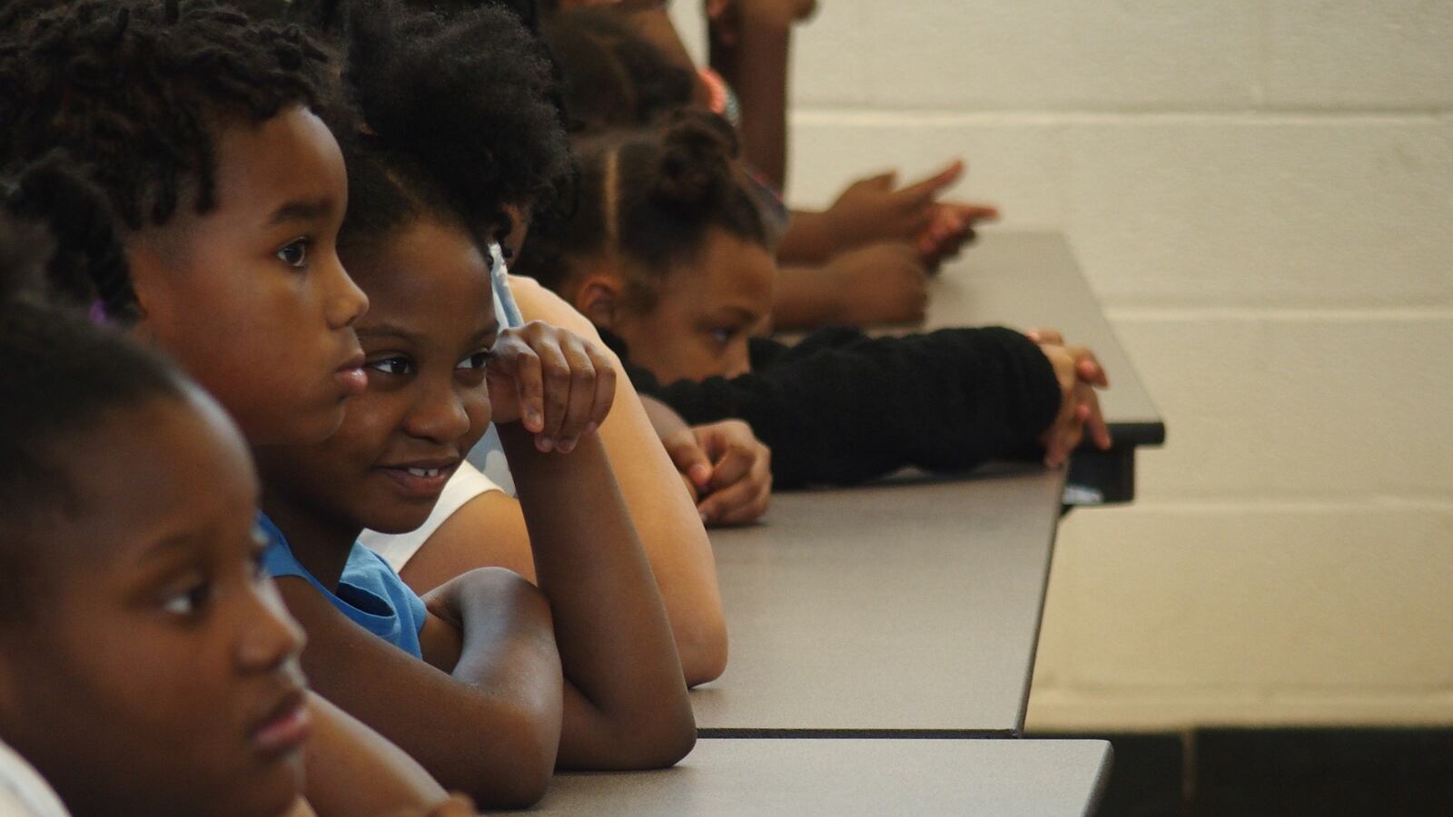 Students at Willow Oaks Elementary School in Memphis watch a performance facilitated by Cazateatro bilingual theater group during Shelby County Schools summer learning academy.
