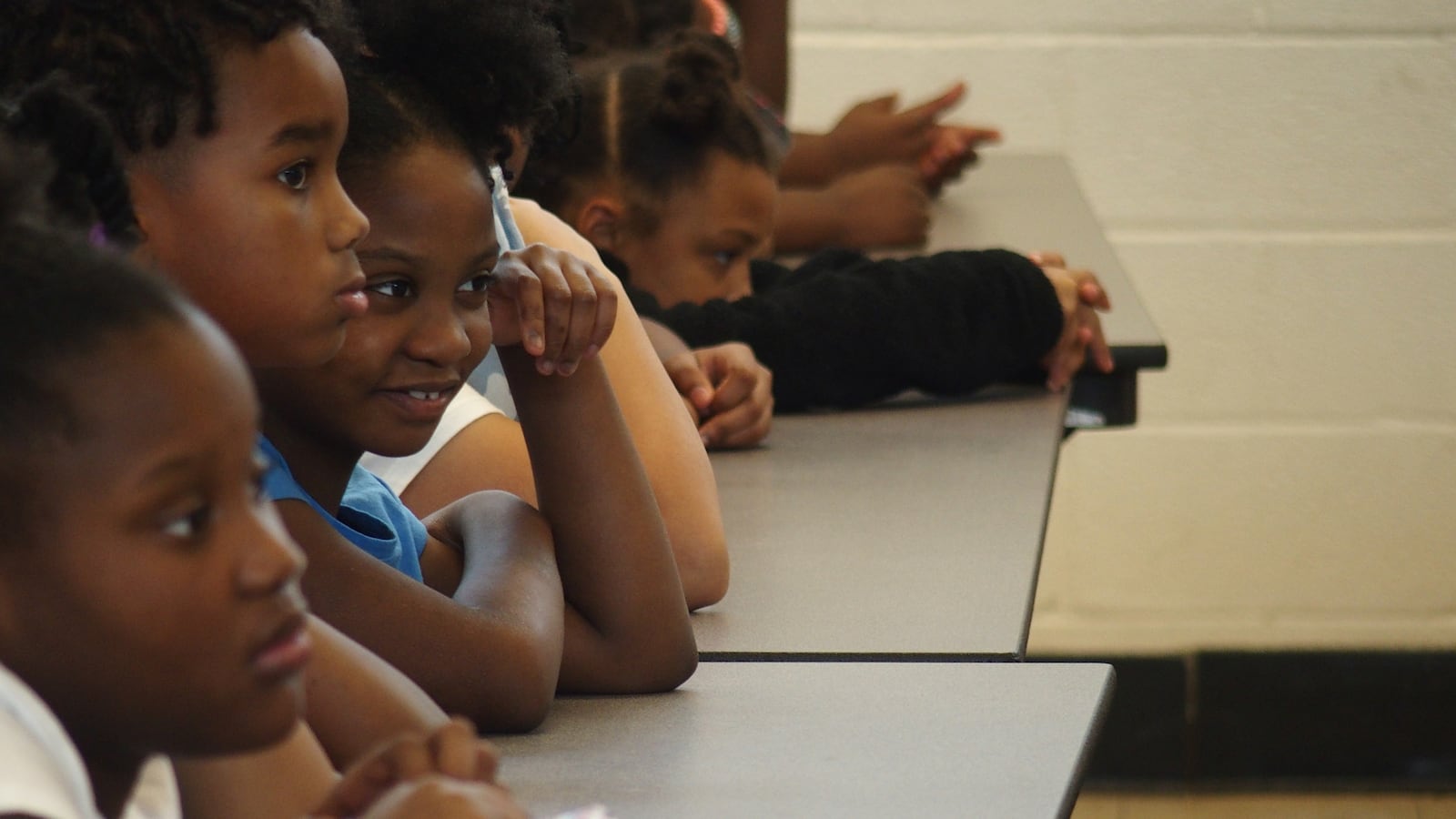 Students at Willow Oaks Elementary School in Memphis watch a performance facilitated by Cazateatro bilingual theater group during Shelby County Schools summer learning academy.