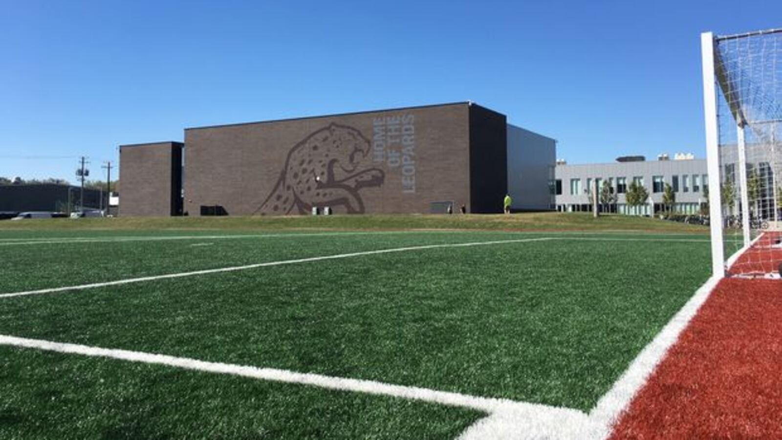 The city's largest charter network will close a day early after a coronavirus cases was confirmed at Mansueto High School.