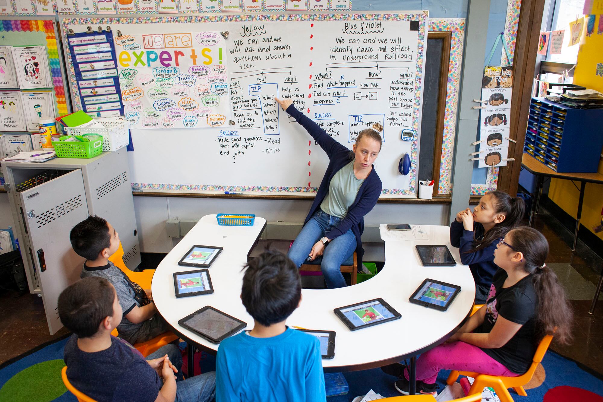 Teacher Kathy McInerney, center, spends intervals of time dedicated to teaching a specific group of students during class at CICS West Belden. The Chicago charter school employs the personalized learning method for its K-8 students. The school is part of the Chicago International Charter School network, and is managed by Distinctive Schools. Photo by Stacey Rupolo/Chalkbeat