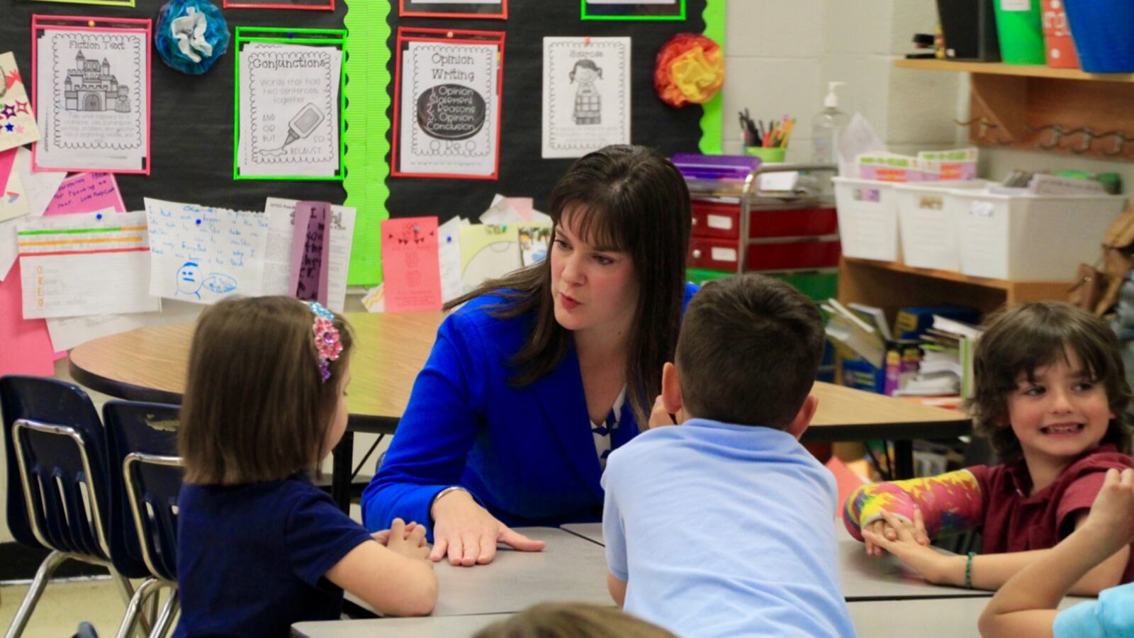 Education Commissioner Candice McQueen visits with students in April at Farmington Elementary School in Germantown.