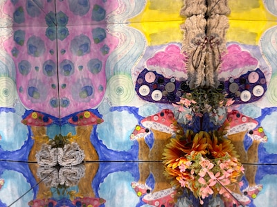 A close up of a panel of colorful art.