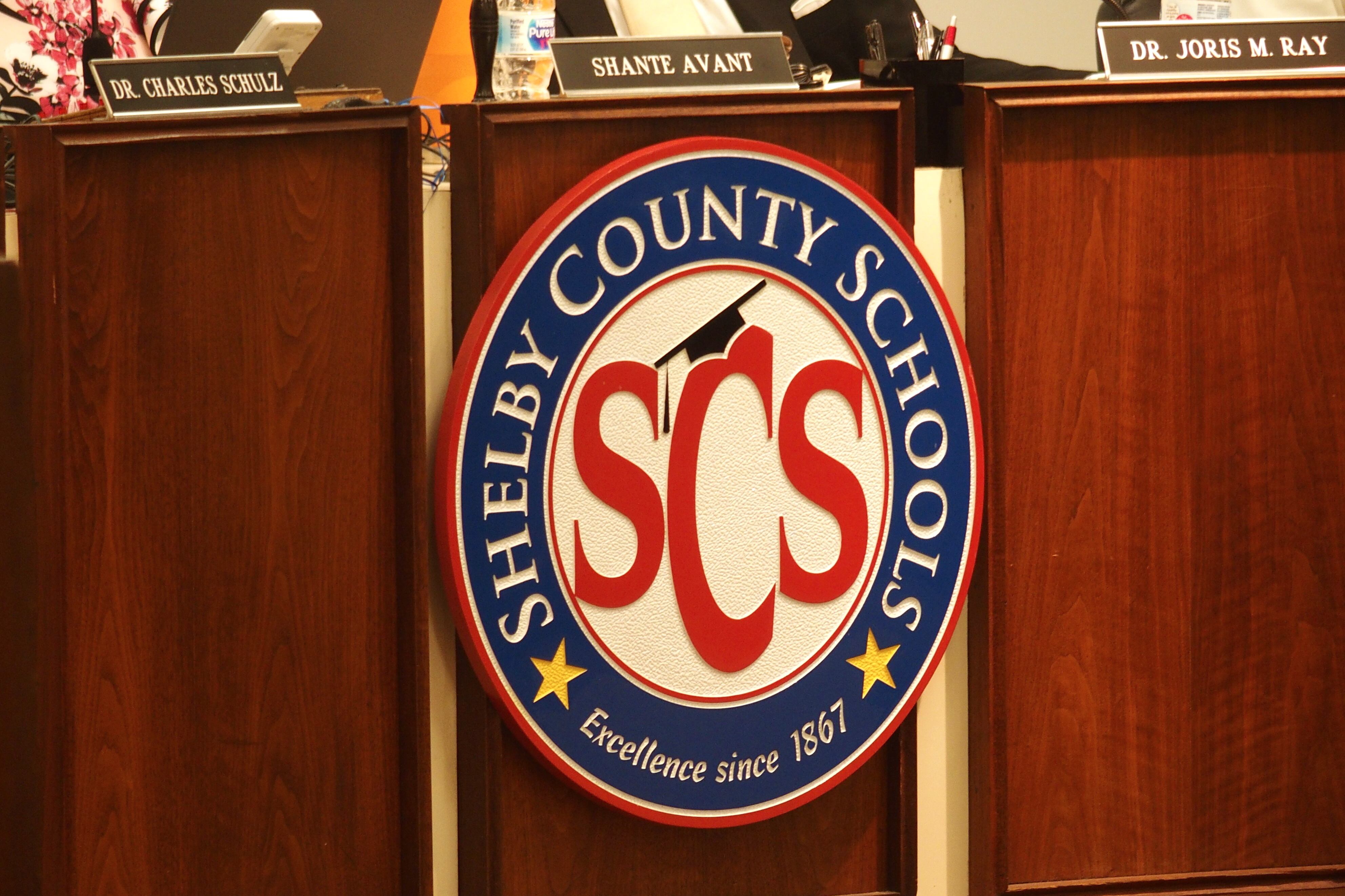 Shelby County Schools logo, SCS surrounded by a white circle, enclosed by a blue circle reading “Shelby County Schools.”