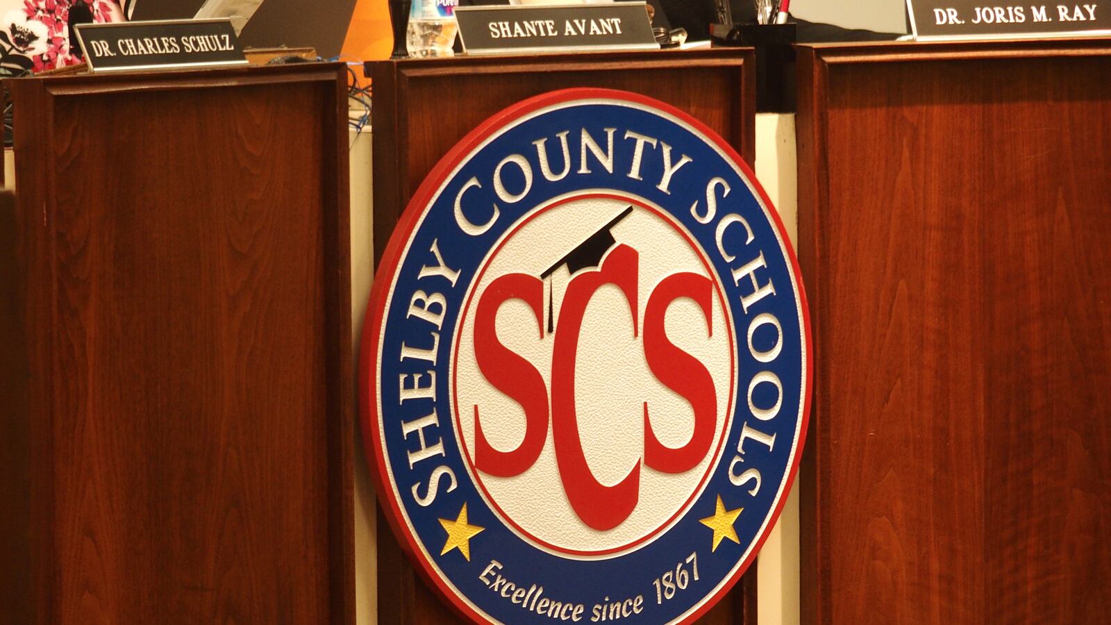 Shelby County Schools logo, SCS surrounded by a white circle, enclosed by a blue circle reading “Shelby County Schools.”
