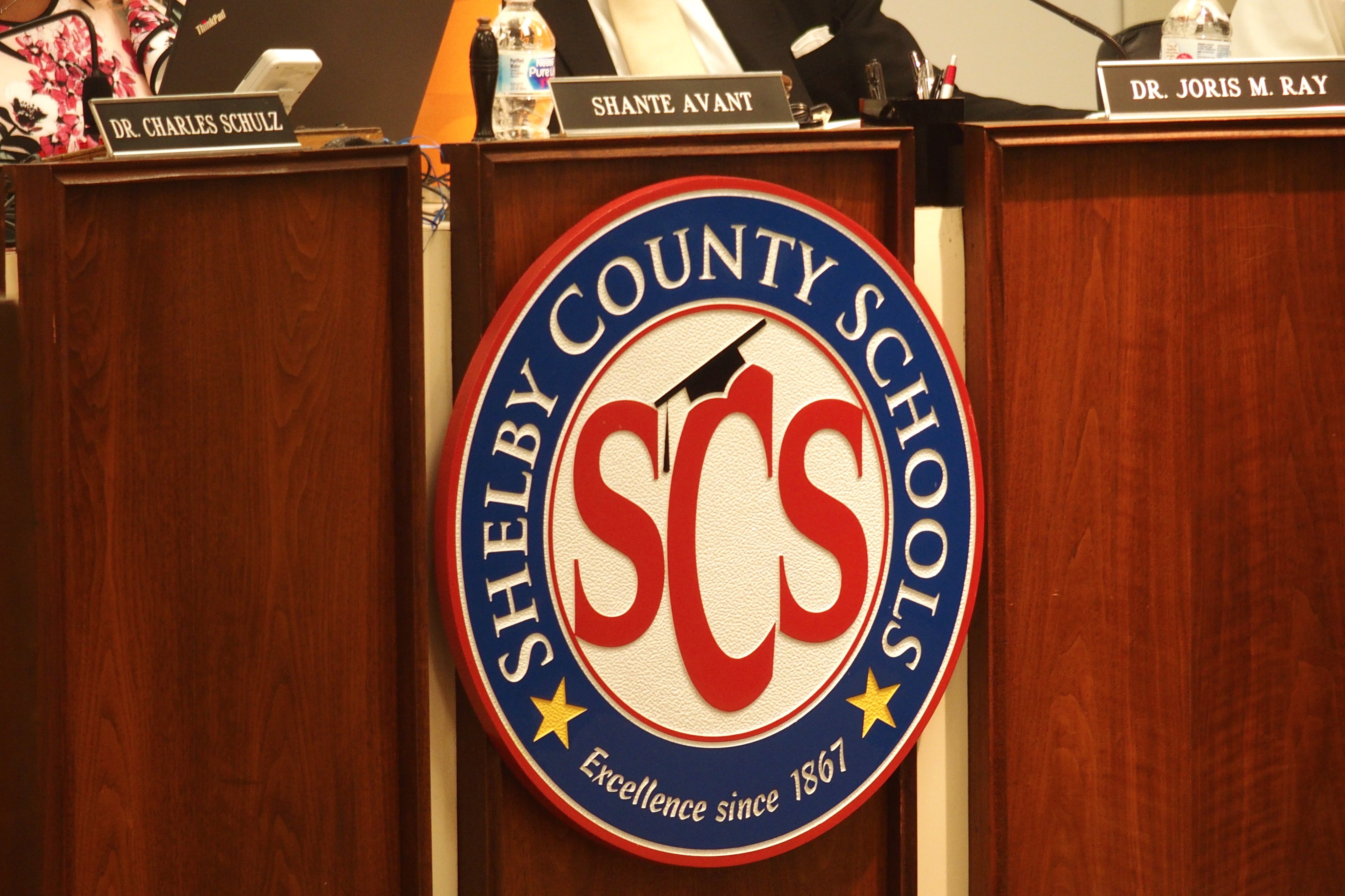 Shelby County Schools logo, SCS surrounded by a white circle, enclosed by a blue circle reading “Shelby County Schools.”
