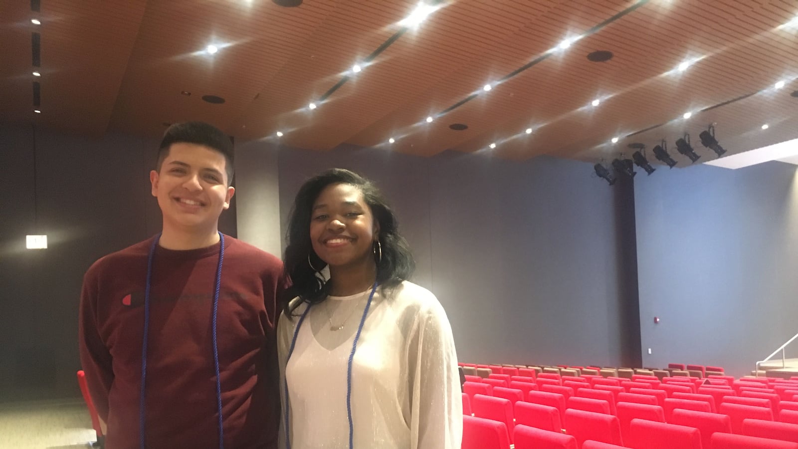 Alan Quintana and Cheyenne Henry stand in the auditorium of Malcolm X College.