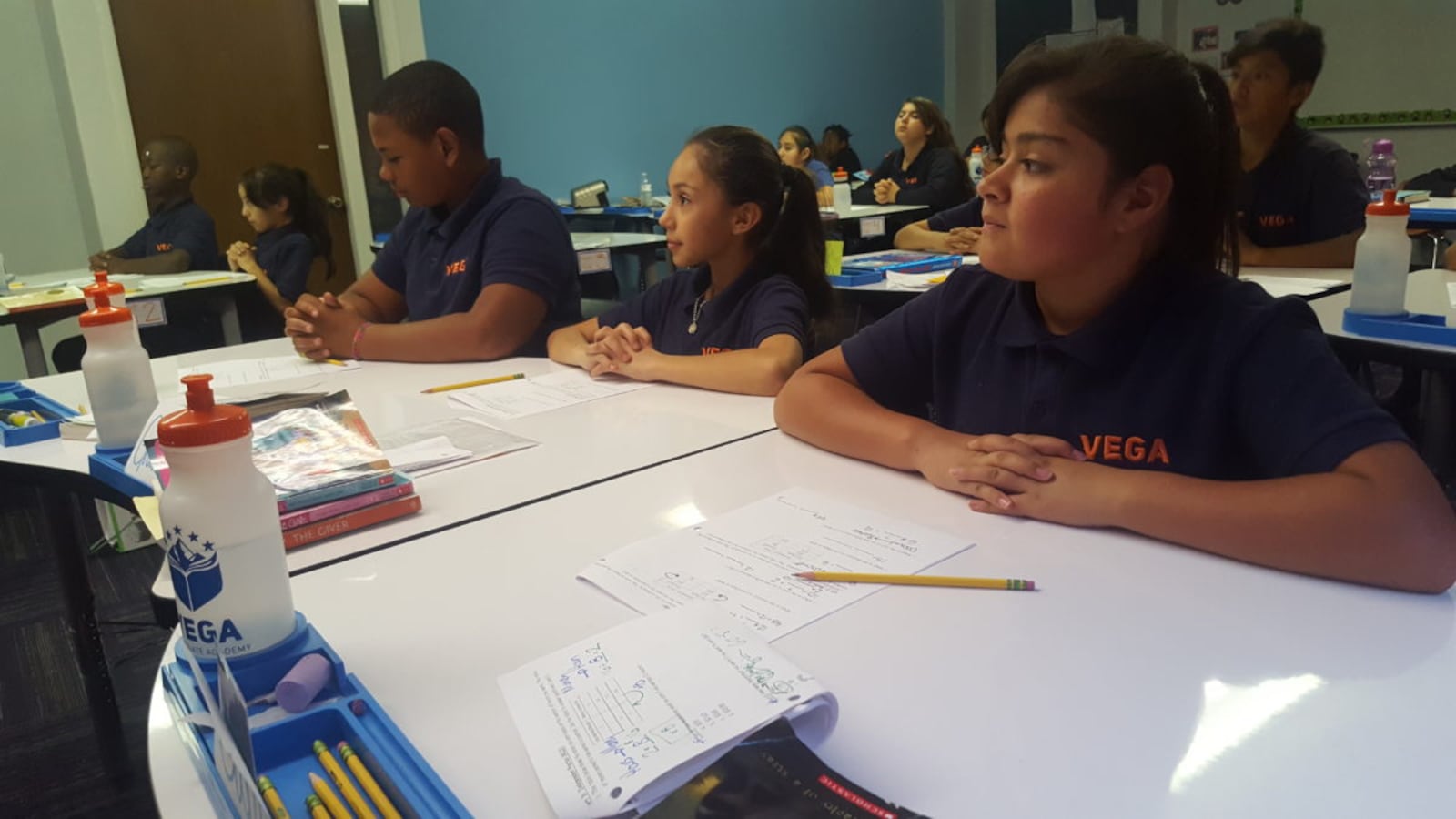 Sixth graders listen to a math lesson at Vega Collegiate Academy in Aurora during a September 2018 class.