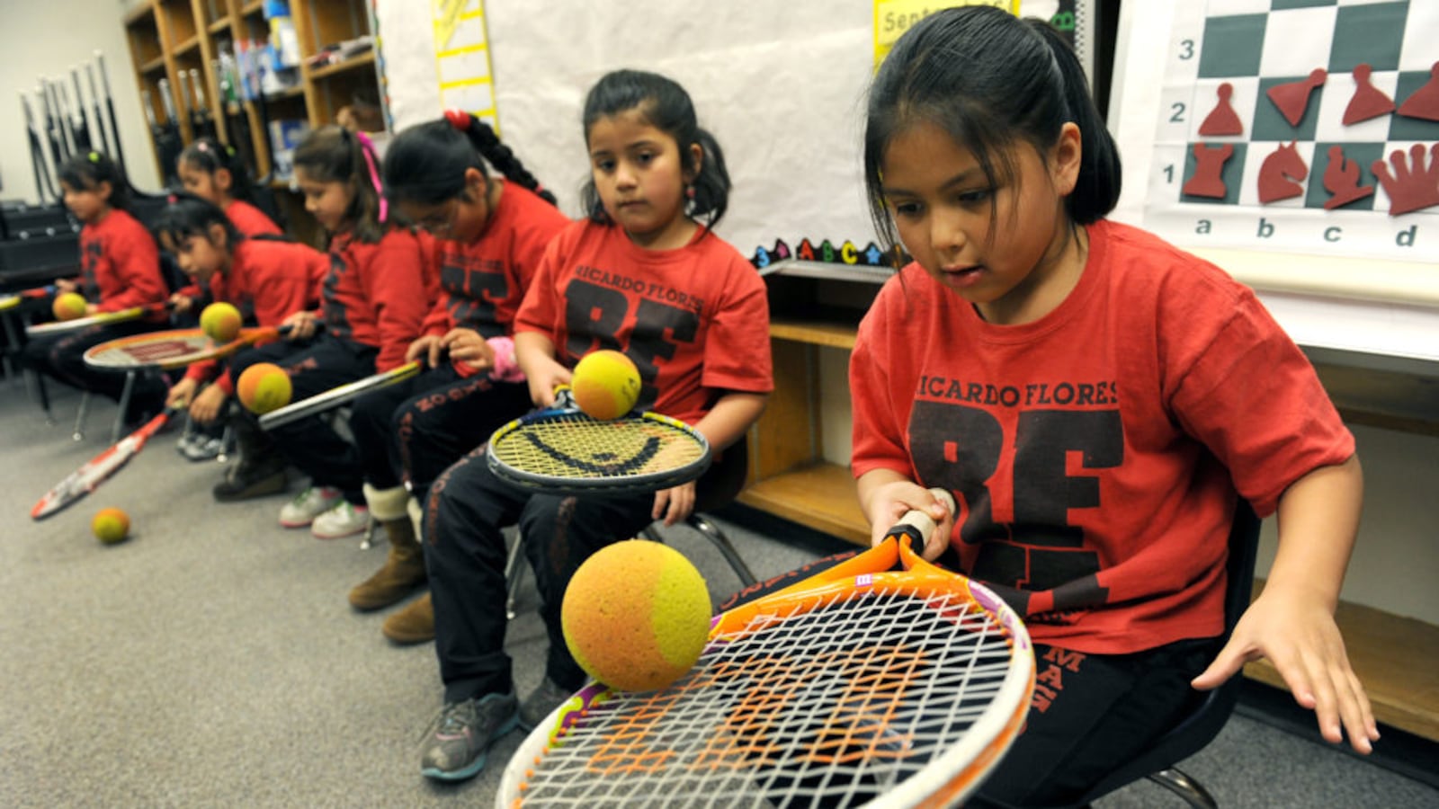 Samantha Belmontes, 7, tries to keep a foam ball rolling in the center of her tennis racket for as long as she can in a class at Ricardo Flores Magón Academy in 2011. (Photo By Helen H. Richardson/The Denver Post via Getty Images)