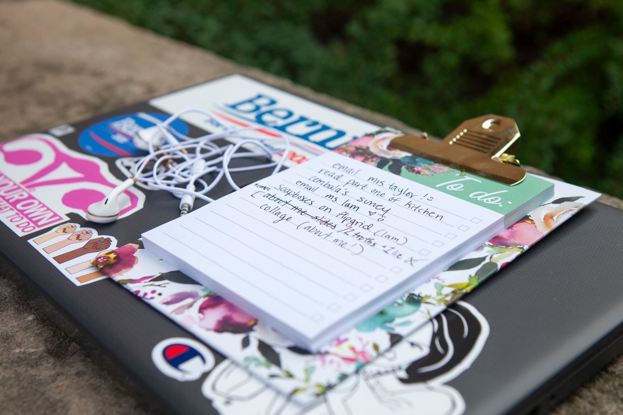 Trinity’s to do list and headphones placed on top of her laptop.
