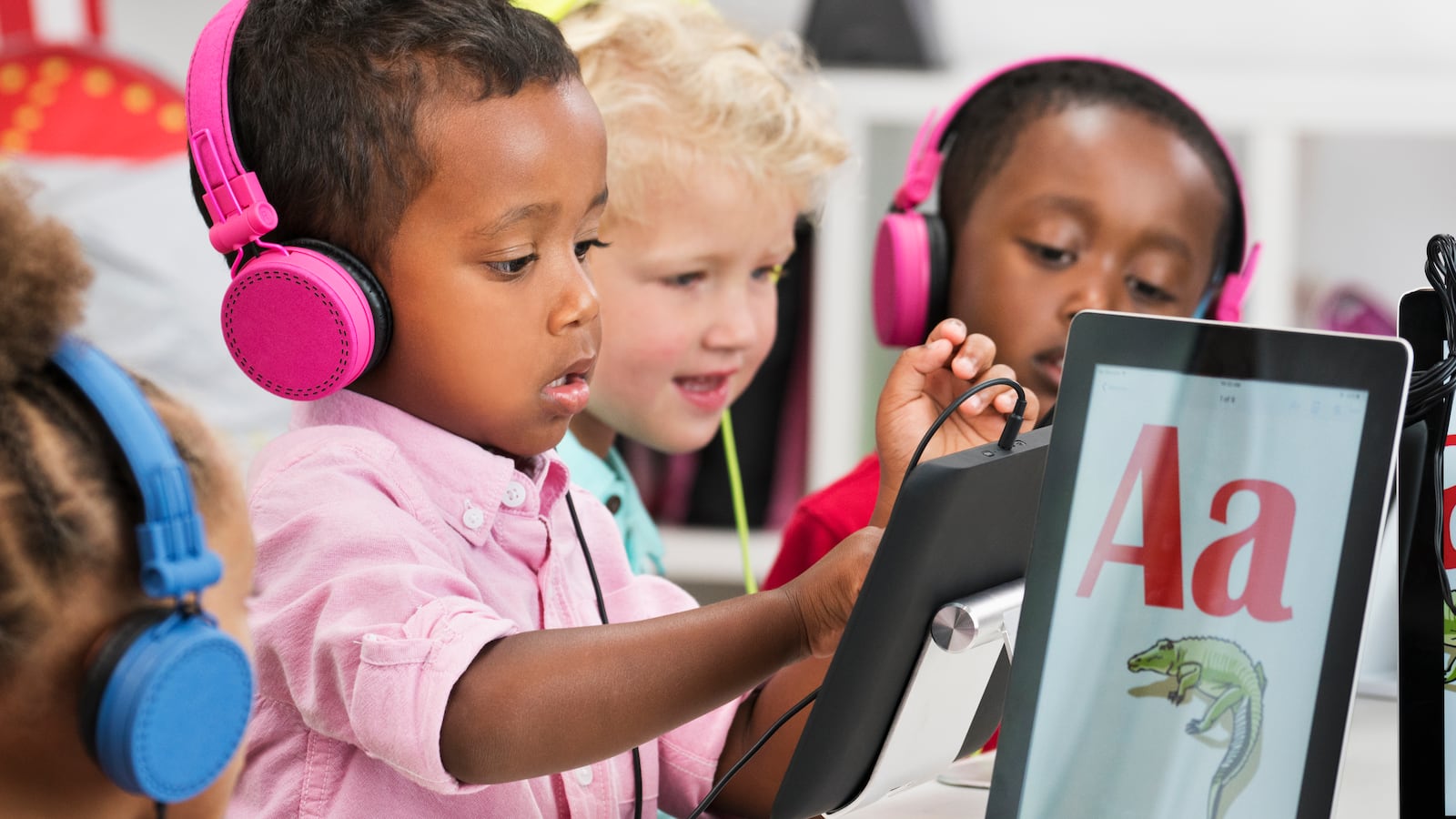 Students learning alphabet with digital tablets (Ariel Skelley | Getty Images)