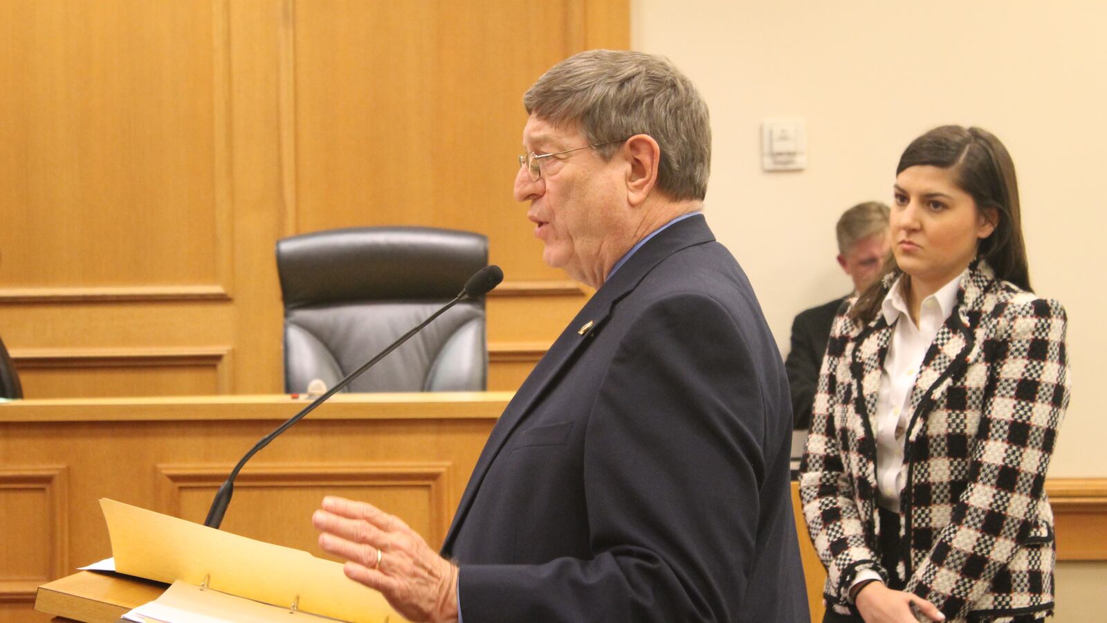 Rep. Harry Brooks and Assistant Commissioner of policy Elizabeth Fiveash present the charter proposal to lawmakers on Wednesday.