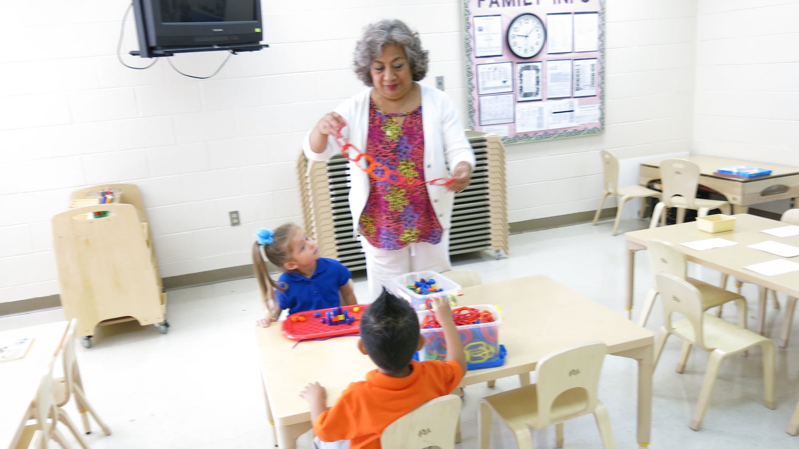 Students in a classroom at Casa Azafran interact with their teacher on the morning of their first-ever day of school.