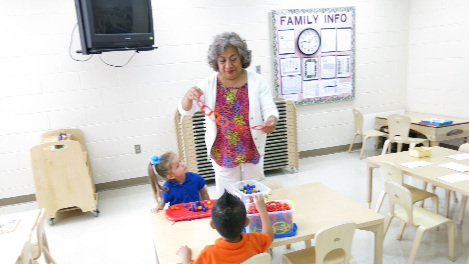 Students in a classroom at Casa Azafran interact with their teacher on the morning of their first-ever day of school.