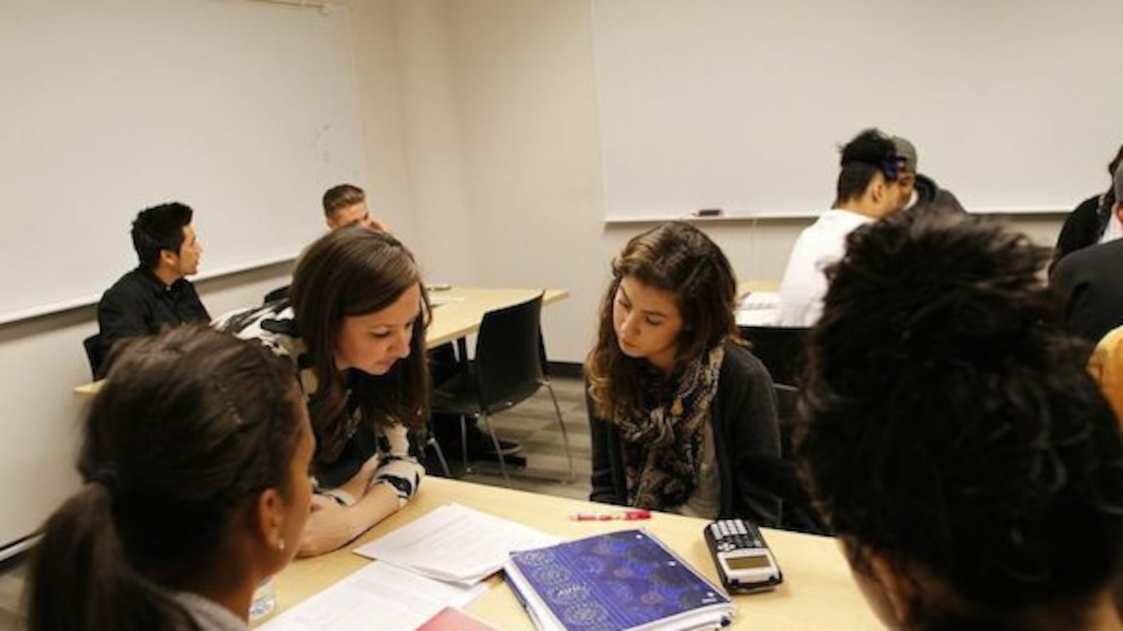 Students discuss a math problem in 2014 as part of a Metro State program meant to bring students up to speed without remediation. (Photo by Tim Carroll )