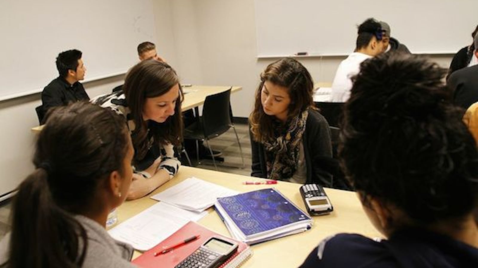 Students discuss a math problem in 2014 as part of a Metro State program meant to bring students up to speed without remediation. (Photo by Tim Carroll )