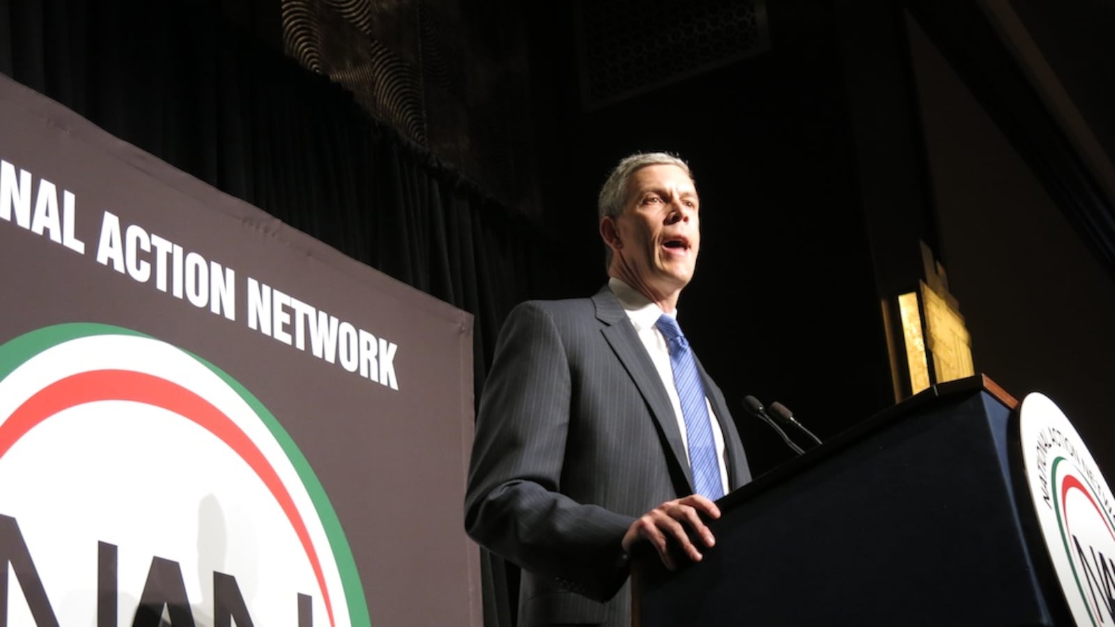 Arne Duncan speaking at Al Sharpton's National Action Network conference in 2014.