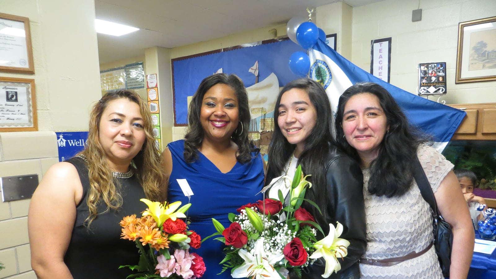 Principal Yolanda Heidelberg with former student Maria Pena (third from left) and family members.