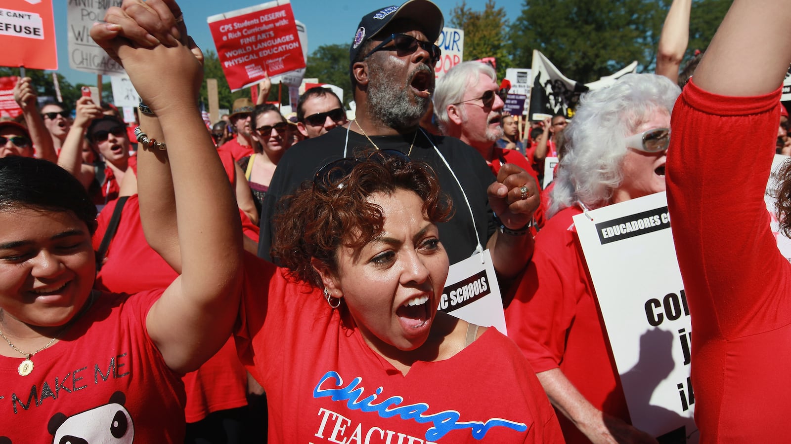 Striking Chicago teachers and their supporters attended a rally at Union Park September 15, 2012 in Chicago, Illinois. An estimated 25,000 people gathered in the park in a show of solidarity as negotiations on a labor contract continued. (Photo by Scott Olson/Getty Images)